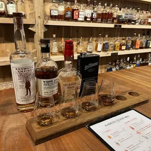 a selection of whiskeys and glasses