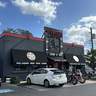 a parking lot with parked motorcycles