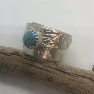 Wide wrap ring, with added turquoise on the snowflake pattern.
