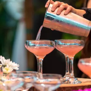 a bartender pouring a drink