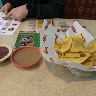 The chips and salsa also come with refried beans