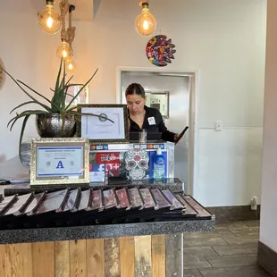 a woman behind the counter