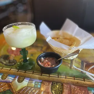 Frozen margarita with chips and salsa.