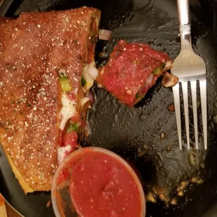 Half eaten deluxe stromboli