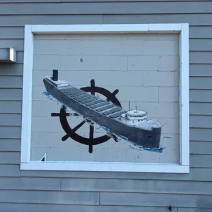 a ship and steering wheel