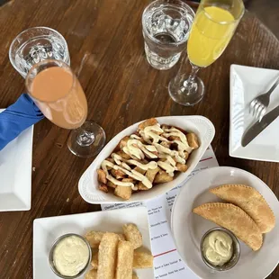 MIMOSAS: Grapefruit &amp; Passion Fruit, Empanadas Stuffed Pastry Shells with Mozzarella Choice of Chicken Fried Yuca with Sriracha Aioli
