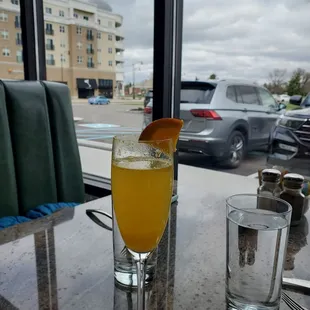 Traditional mimosa at one of my favorite seats in the place!