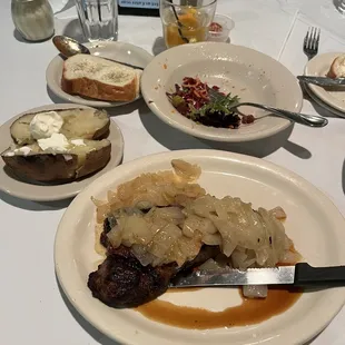 New York Strip with fried onions baked potato and side salad. It was very juicy and flavorful.