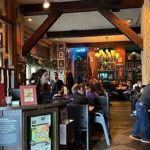 people sitting at tables in a restaurant