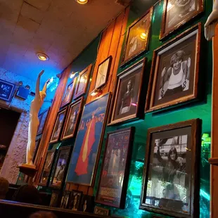 a wall full of framed photos