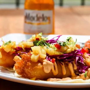 Cod-fish tacos! Topped with our pineapple salsa &amp; secret sauce. Try it with prawns! Make it a combo too!