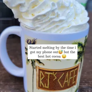 a cup of coffee with whipped cream