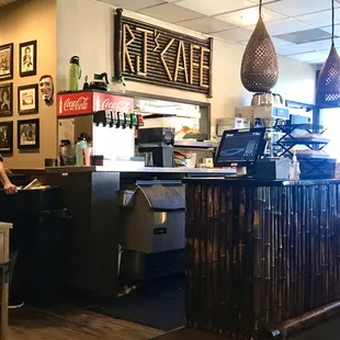 Small area where the waitresses prepare drinks and grab food dishes from the serving hatch.