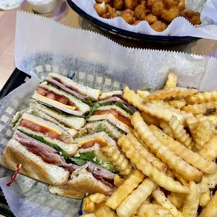 Triple Decker Club Sandwich along with fried cauliflower.