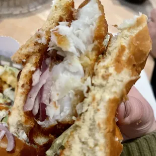 Fish sandwich with added onions.