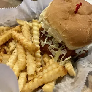 Fish sandwich with seasoned fries.