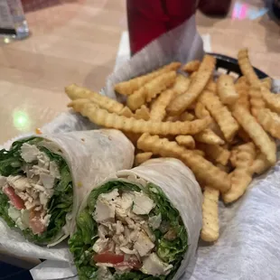 Chicken Caesar Wrap with season fries.