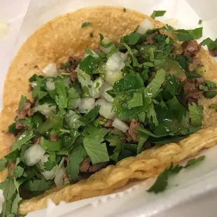 Steak Taco w/cilantro and onion on Corn tortilla