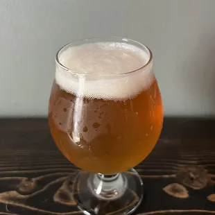 a glass of beer on a table