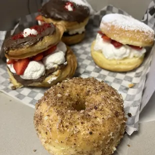 3 Specialty donuts with a regular in front