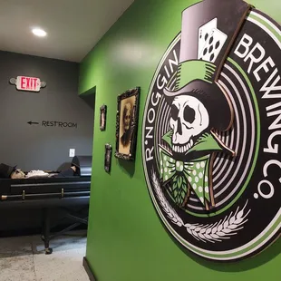a green wall with a skull on it