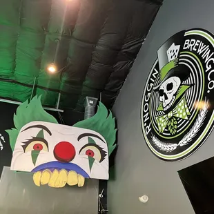 a clown mask hanging from the ceiling