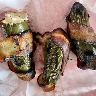 Large, cream cheese-stuffed, bacon-wrapped jalapeños. Nicely grilled. Not too spicy.