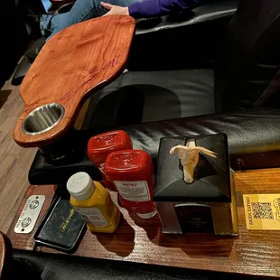 The condiments and a call button to request food and drinks