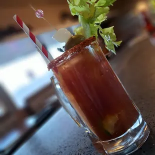 a bloody drink with a garnish of celery