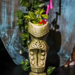 a vase with a plant in it