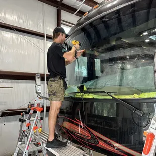 Ceramic 70% VLT windshield tint application on a large motorhome
