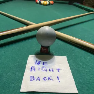 a pool table with a billiards sticker on it