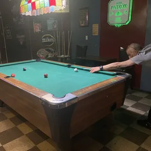 a man playing a game of pool