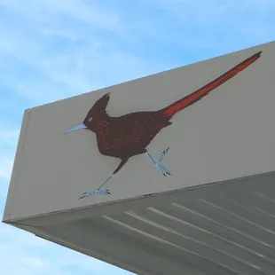 a bird painted on the side of a building