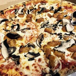 a pizza with mushrooms and cheese
