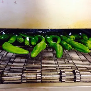 Fresh green chile! roasted, cut and topped on your pizza all on the same day!