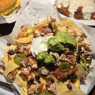 Chicken nachos, chicken fried chicken, and blackened burger.