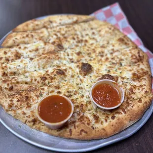 a pizza with sauces on it