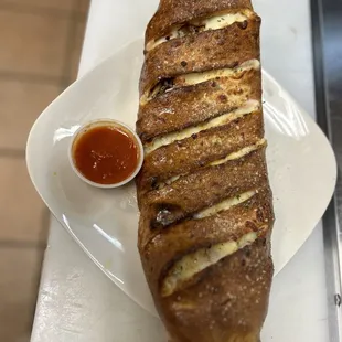 a long loaf of bread on a plate