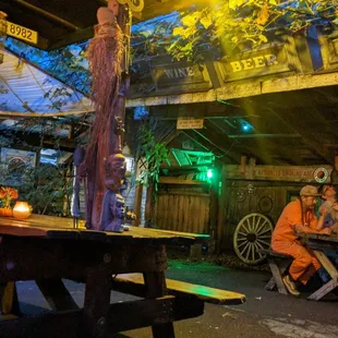 a man sitting at a picnic table