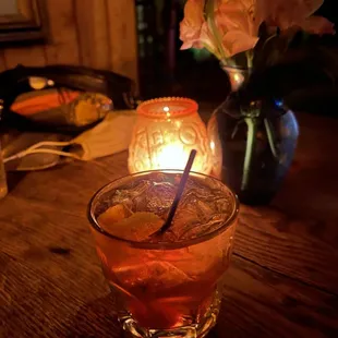 a drink in a glass on a table