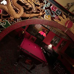 a pool table and a mirror