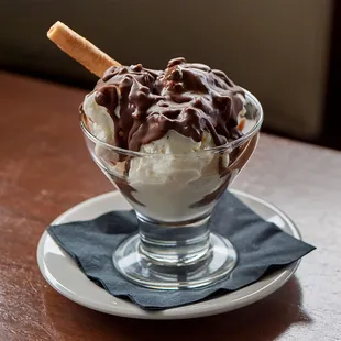 a chocolate covered ice cream sundae
