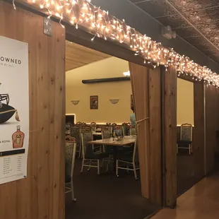 A view from seating area to another, with the fun Christmas lights.