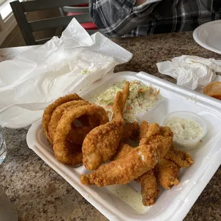That catfish combo is crispy and delightful- crunchy onion rings and sweet slaw!