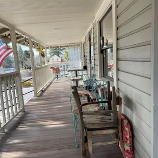 porch with chairs and american flag