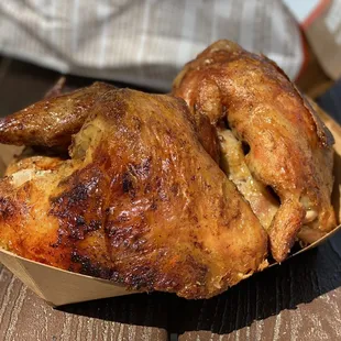 a chicken in a paper container