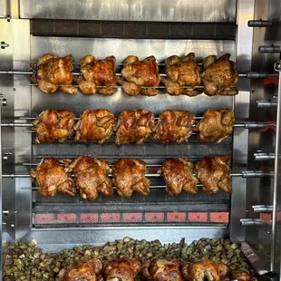 chickens being cooked in a commercial oven