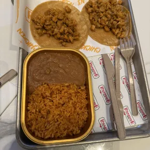 Chicken tacos with rice and beans on the side. About $23...