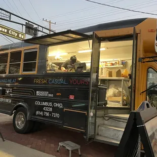a food truck parked on the side of the road